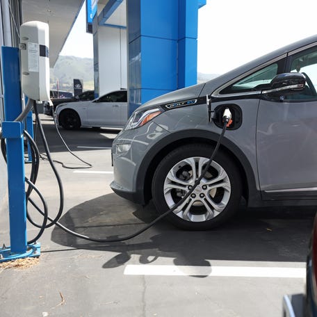 COLMA, CALIFORNIA - APRIL 25: A Chevrolet Bolt EV sits parked at a charging station at Stewart Chevrolet on April 25, 2023 in Colma, California. Chevrolet announced plans to phase out production of its Chevrolet Bolt electric vehicles as the company paves the way for a new generation of electric vehicles.