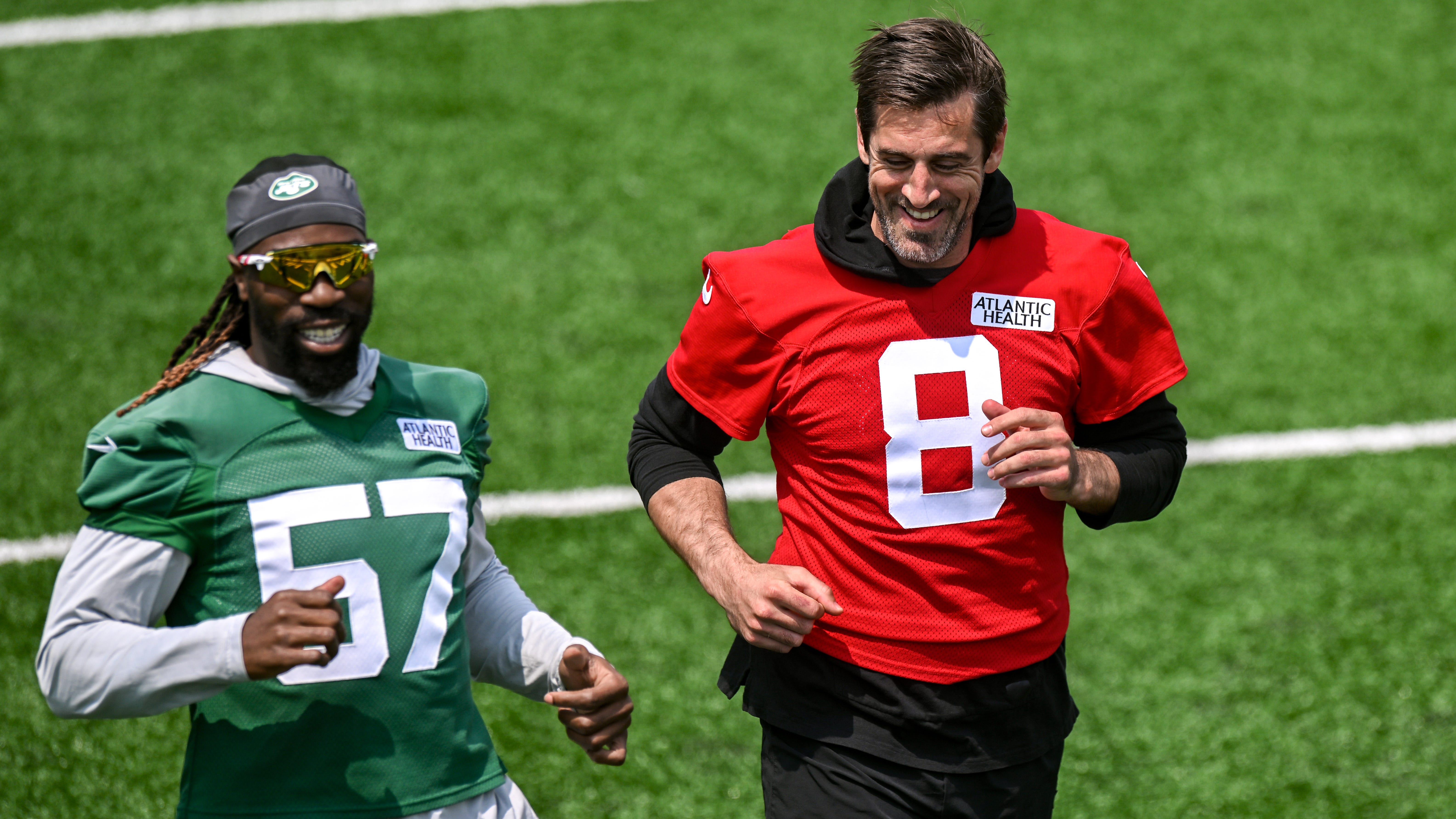 New York Jets quarterback Aaron Rodgers (8) warms up during OTA's at Atlantic Health Jets Training Center.