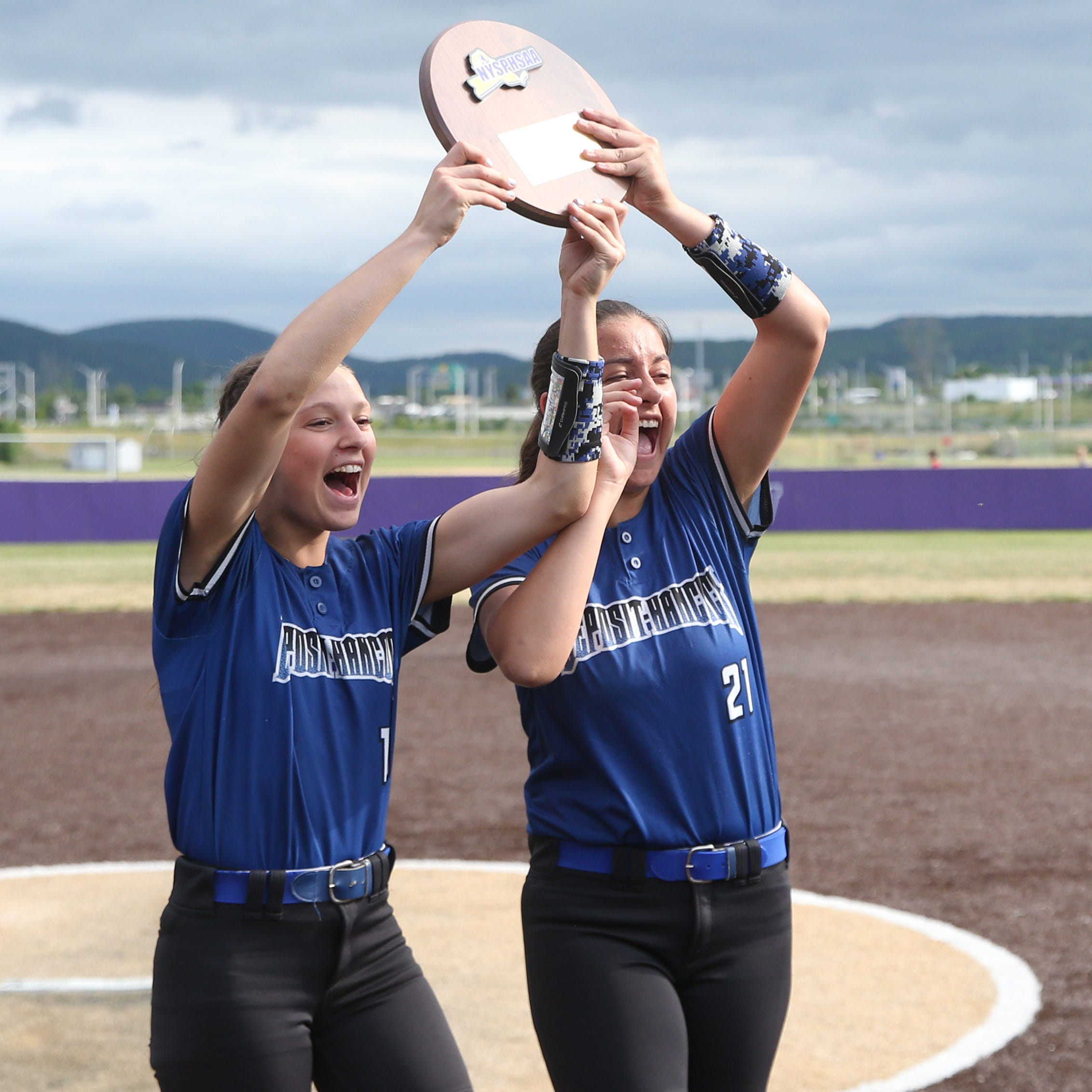 Deposit-Hancock's, from left, Kaitlyn Macumber and Kelsey Tank cheer as they bring the championship plaque to their teammates after winning the New York State Class D regional final versus Eldred on June 3, 2023. 