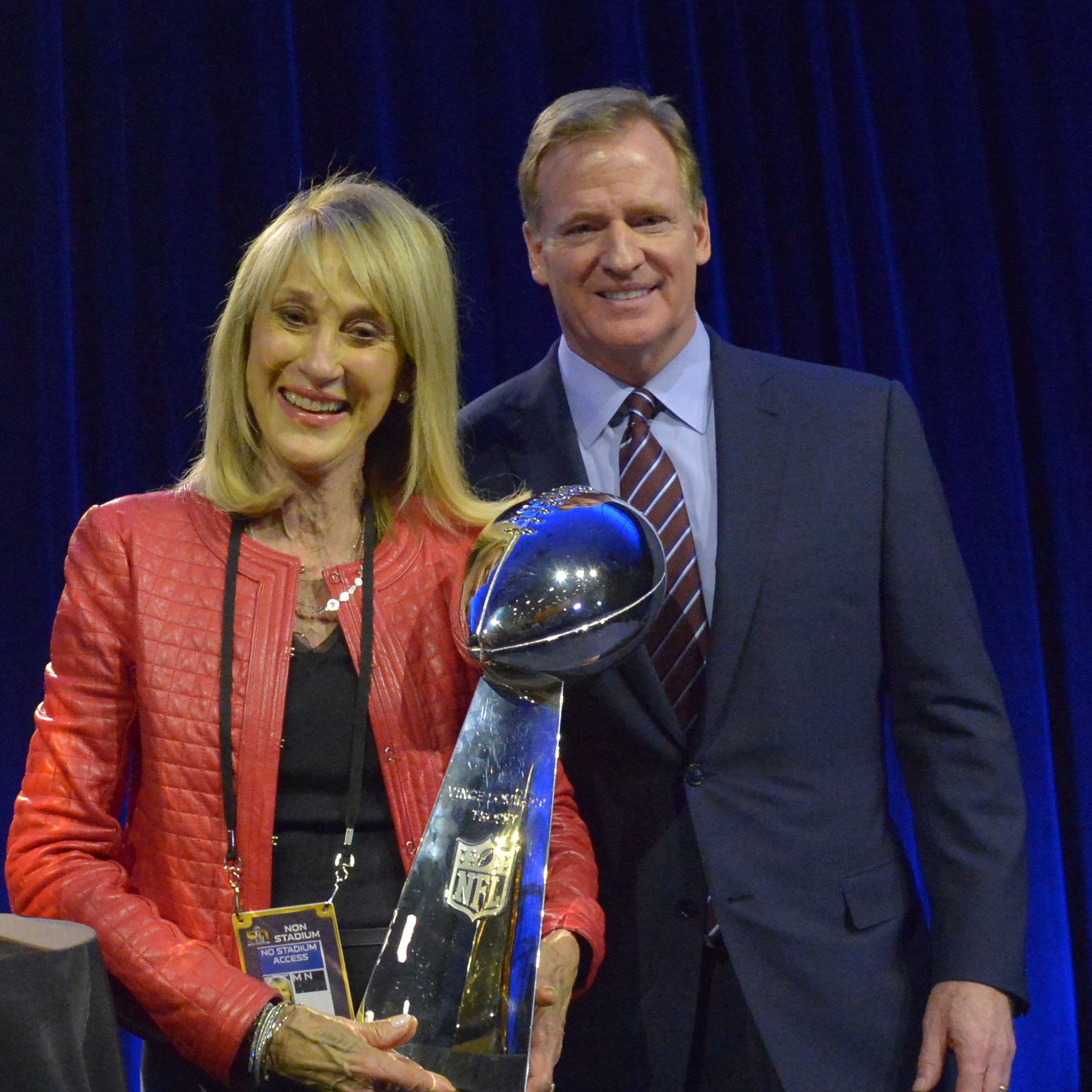 Kansas City Chiefs' Norma Hunt and NFL commissioner Roger Goodell pose with the Lombardi Trophy before Super Bowl 50.