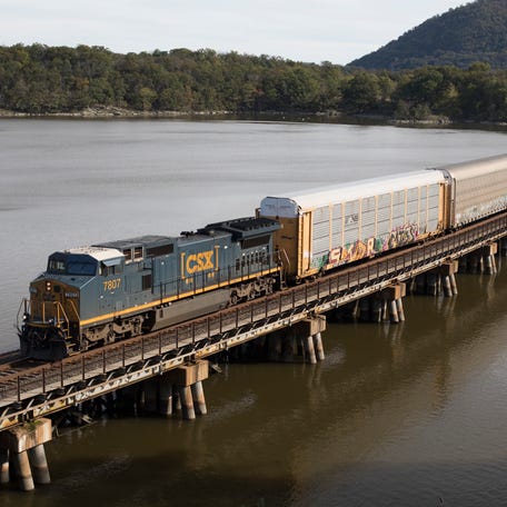 A CSX freight train of autoracks crosses a bridge from Iona Island to the west shore of the Hudson River near Bear Mountain, N.Y., on Oct. 16, 2018, on the railroad's River Subdivision.
