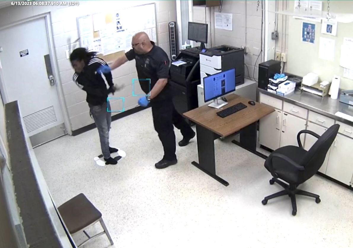 Warren officer charged with assault after punching, slamming prisoner