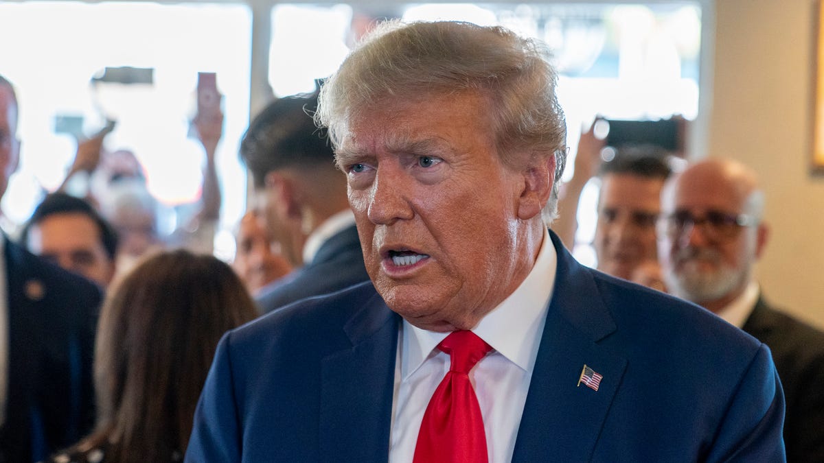 Former President Donald Trump speaks to the media as he visits Versailles restaurant on Tuesday, June 13, 2023, in Miami. Trump appeared in federal court Tuesday on dozens of felony charges accusing him of illegally hoarding classified documents and thwarting the Justice Department's efforts to get the records back.