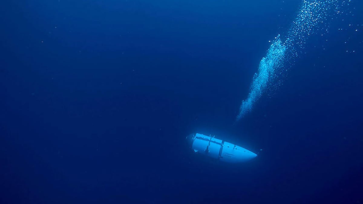 This undated image courtesy of OceanGate Expeditions, shows their Titan submersible during a descent. Rescue teams expanded their search underwater on June 20, 2023, as they raced against time to find a Titan deep-diving tourist submersible that went missing near the wreck of the Titanic with five people on board and limited oxygen. All communication was lost with the 21-foot (6.5-meter) Titan craft during a descent June 18 to the Titanic, which sits at a depth   of crushing pressure more than two miles (nearly four kilometers) below the surface of the North Atlantic. (Photo by Handout / OceanGate Expeditions / AFP) / RESTRICTED TO EDITORIAL USE - MANDATORY CREDIT "AFP PHOTO / OceanGate Expeditions" - NO MARKETING NO ADVERTISING CAMPAIGNS - DISTRIBUTED AS A SERVICE TO CLIENTS (Photo by HANDOUT/OceanGate Expeditions/AFP via Getty Images) ORIG FILE ID: AFP_33KD8MC.jpg