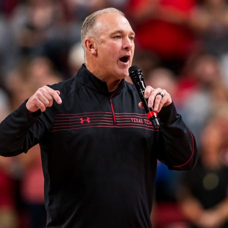 Texas Tech football coach Joey McGuire addresses fans at a 2021 Red Raiders basketball game in Lubbock.