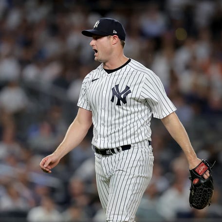 New York Yankees starting pitcher Gerrit Cole (45) reacts during the seventh inning against the Seattle Mariners at Yankee Stadium.