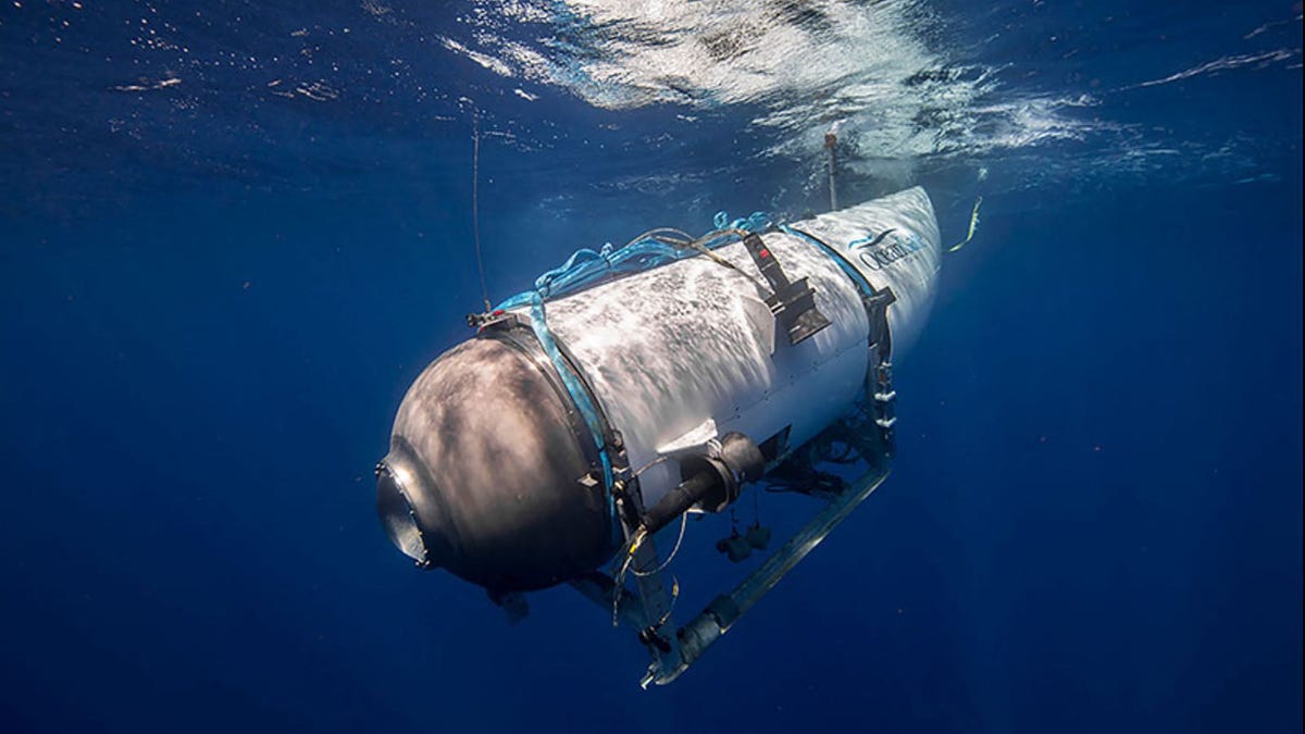 This undated image courtesy of OceanGate Expeditions, shows their Titan submersible beginning a descent. Rescue teams expanded their search underwater on June 20, 2023, as they raced against time to find a Titan deep-diving tourist submersible that went missing near the wreck of the Titanic with five people on board and limited oxygen. All communication was lost with the 21-foot (6.5-meter) Titan craft during a descent June 18 to the Titanic, which sits at a   depth of crushing pressure more than two miles (nearly four kilometers) below the surface of the North Atlantic. (Photo by Handout / OceanGate Expeditions / AFP) / RESTRICTED TO EDITORIAL USE - MANDATORY CREDIT "AFP PHOTO / OceanGate Expeditions" - NO MARKETING NO ADVERTISING CAMPAIGNS - DISTRIBUTED AS A SERVICE TO CLIENTS (Photo by HANDOUT/OceanGate Expeditions/AFP via Getty Images) ORIG FILE ID: AFP_33KE8WV.jpg