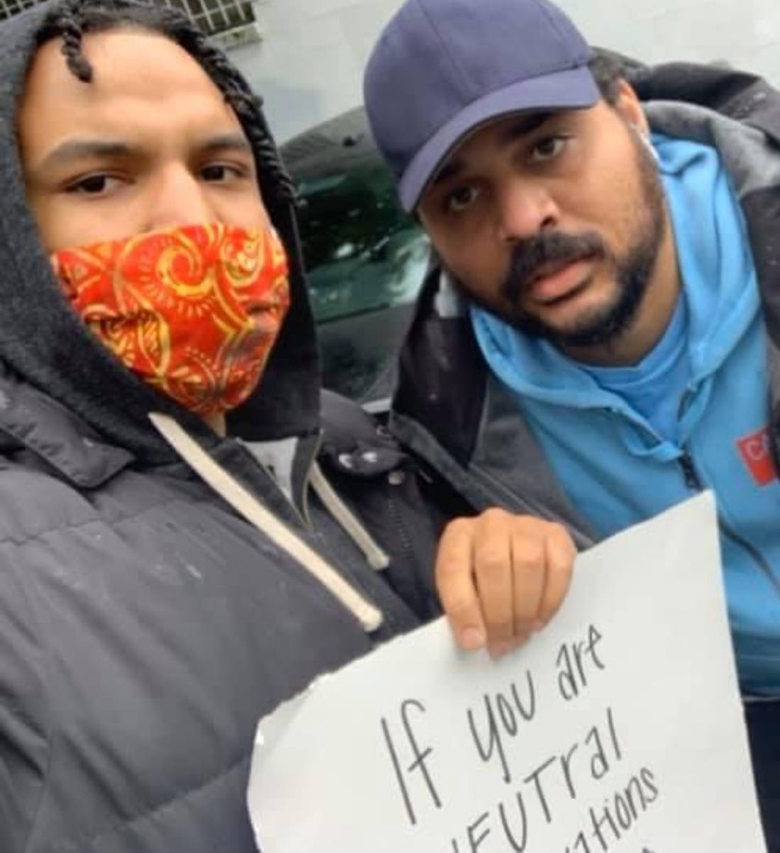Elijah Lewis with his brother, Mario Dunham. The Seattle activist promoted nonviolence and worked to build the Black community. He was shot and killed in April 2023.