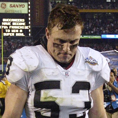 Bill Romanowski leaves the field after the Oakland Raiders lost to the Tampa Bay Buccaneers 48-21 at the Super Bowl 37.