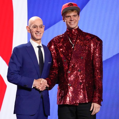 Gradey Dick poses for a photo with NBA Commissioner Adam Silver after being selected 13th overall by the Toronto Raptors during the NBA Draft, Thursday, June 22, 2023, in New York. (AP Photo/John Minchillo) ORG XMIT: NYJJ209