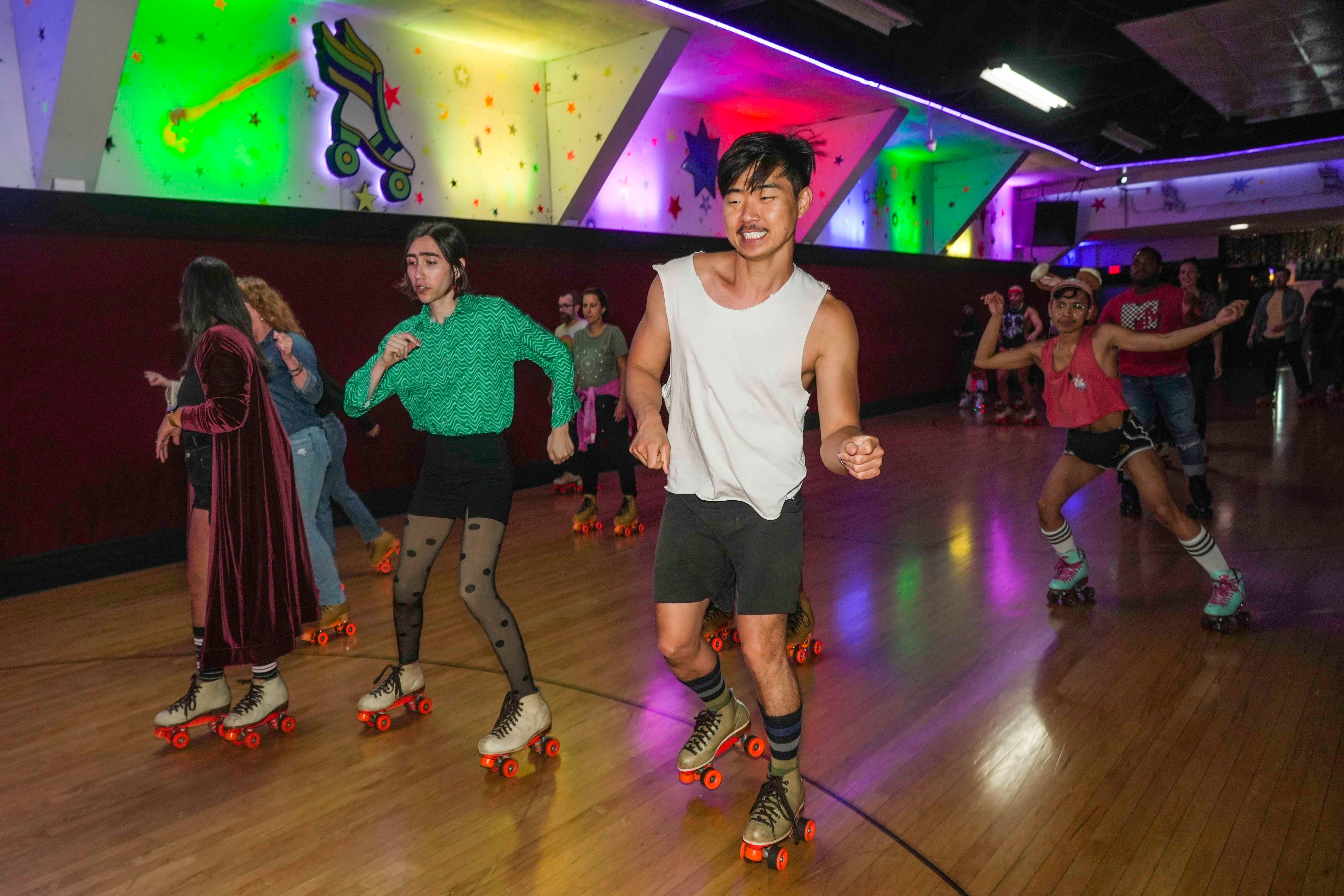 Skaters dance and skate at Rainbow Skate Night hosted by Moonlight Rollerway in Glendale, Calif. Rainbow Skate Night is the longest LGBTQ+-friendly skating event in Los Angeles County.