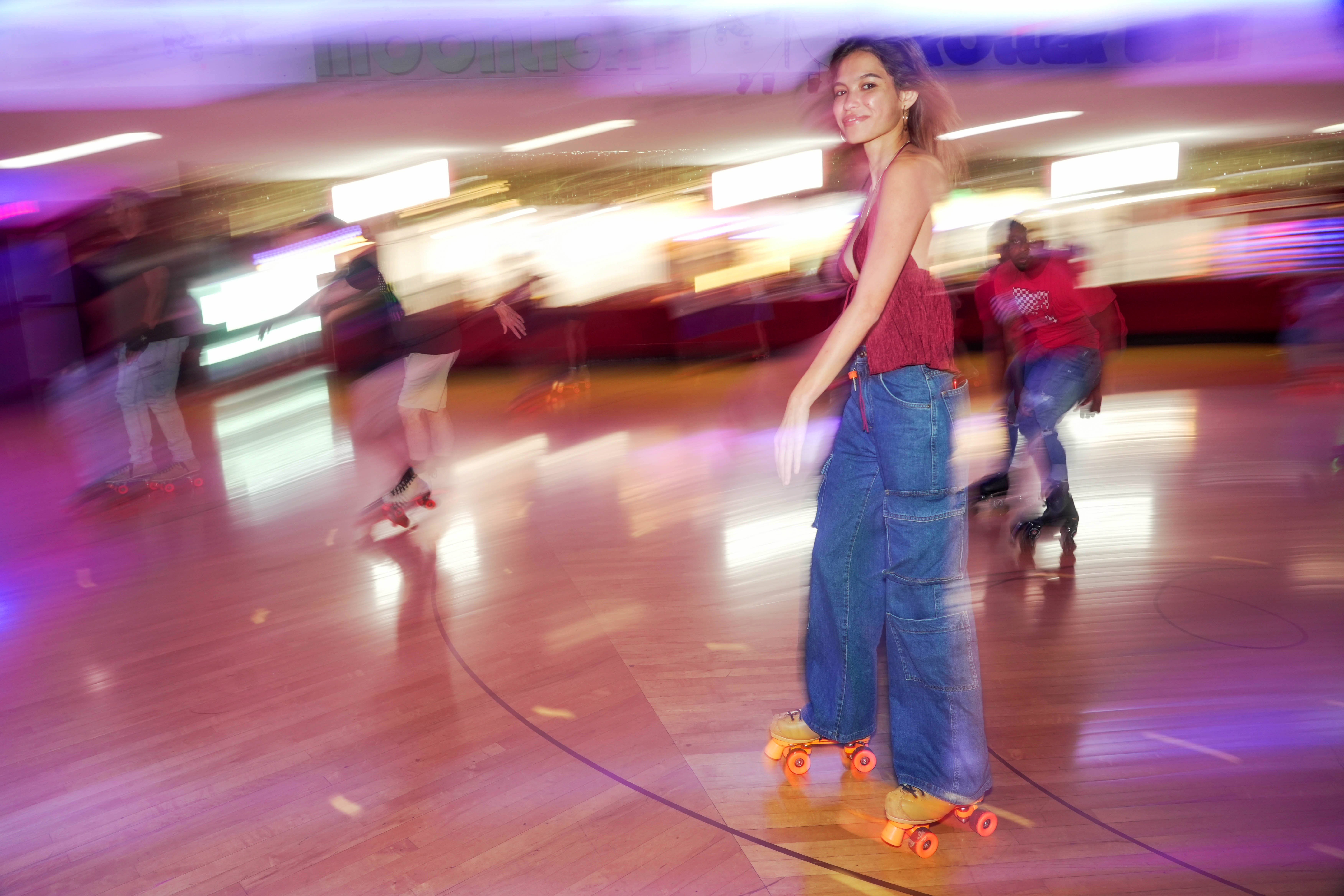 A participant skates at Moonlight Rollerway on Rainbow Skate Night, the longest LGBTQ+-friendly skating event in Los Angeles County.