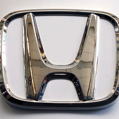This Feb. 14, 2019 file photo shows a Honda logo at the 2019 Pittsburgh International Auto Show in Pittsburgh. Honda is recalling more than 380 Civic, Accord, Acura RDX and Integra vehicles for a potential brake issue.