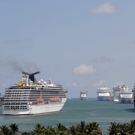 Cruise ships float at PortMiami, on April 7, 2020, in Miami.