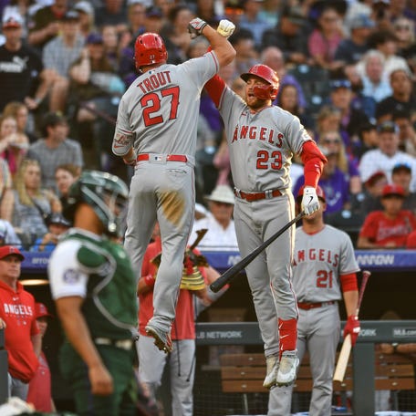 Mike Trout (27) and the Los Angeles Angels scored a team record 25 runs Saturday night against the Colorado Rockies.
