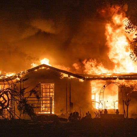 A house burns on Platina Road at the Zogg Fire near Ono, Calif., on Sept. 27, 2020. A Northern California judge on Wednesday, May 31, 2023, dismissed all charges against Pacific Gas & Electric for its role in the 2020 fatal wildfire sparked by its equipment that destroyed hundreds of homes and killed four people, including an 8-year-old child.