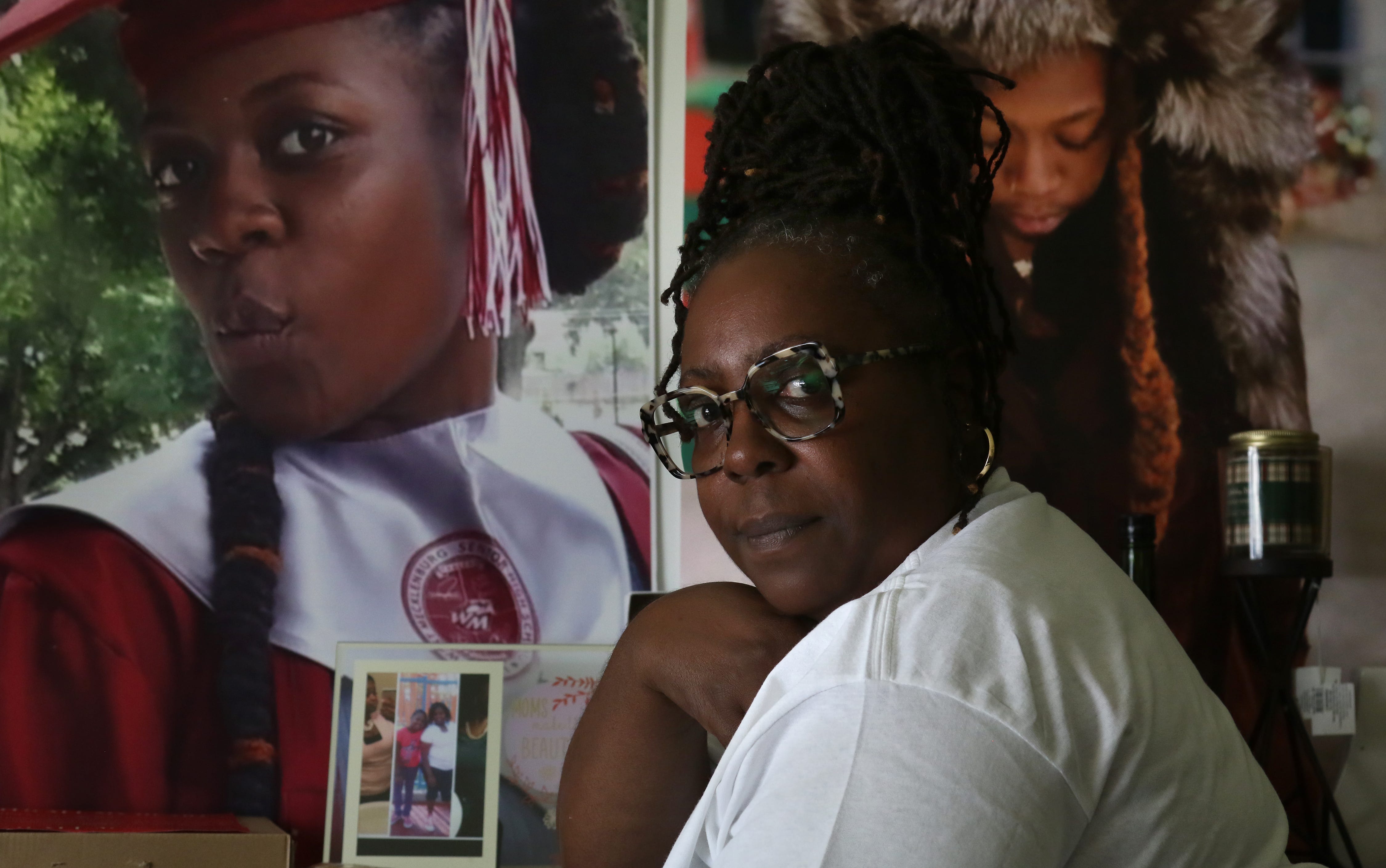 Wanda Brown Steele sits in her small apartment in Charlotte surrounded by photos of her daughter, Anndel Taylor, who died while trapped on the side of the road in her car during a blizzard in Buffalo, New York.