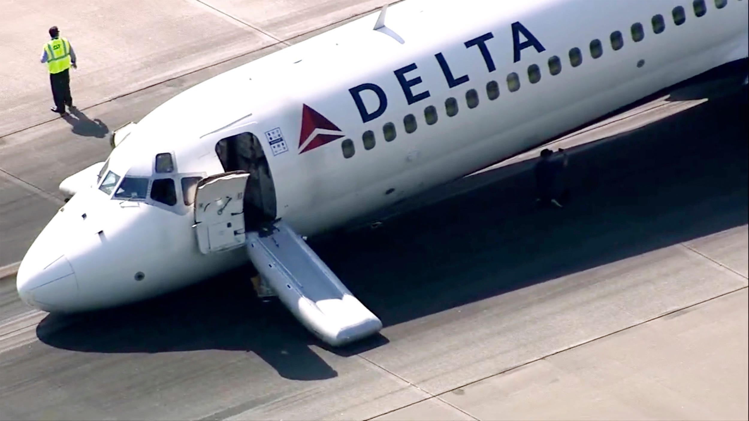 A Delta plane lands without its landing gear at the Charlotte Douglas International Airport, Wednesday, June 28, 2023 in Charlotte, N.C.   The airport said in a tweet that the runway was closed following a mechanical issue with Delta Air Lines. No injuries were reported and all passengers were taken to the terminal. The airport said it was working to remove the aircraft and reopen the runway.