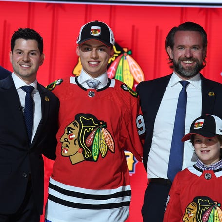 Connor Bedard shares the draft stage after being selected No. 1 overall by the Chicago Blackhawks.