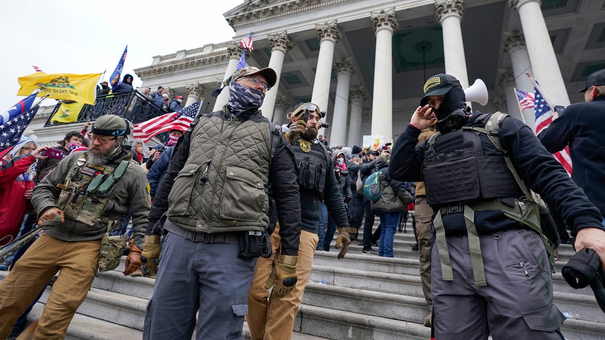 Members of the Oath Keepers extremist group stand on the East Front of the U.S. Capitol on Jan. 6, 2021, in Washington. David Moerschel, a 45-year-old neurophysiologist from Punta Gorda, Fla., who stormed the U.S. Capitol with other members of the far-right Oath Keepers group, was sentenced Friday to three years in prison for seditious conspiracy and other charges, the latest in a historic string of sentences in the Jan. 6. 2021 attack.