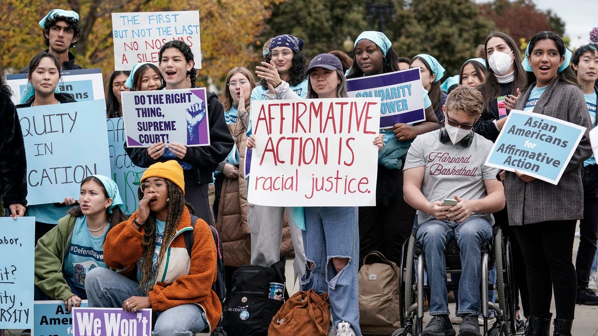 Activists demonstrate in October 2022 as the Supreme Court hears oral arguments on a pair of cases that could decide the future of affirmative action in college admissions.