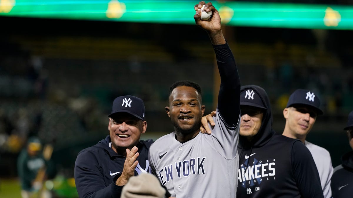 Yankees pitcher Domingo Germán celebrates after throwing a perfect game against the A's.