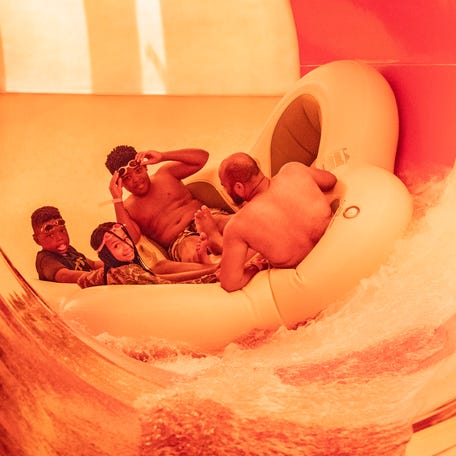 A family enjoys the Great Geyser Water Park at the grand opening of the Great Wolf Lodge in Perryville, Md., Thursday, June 29, 2023.  