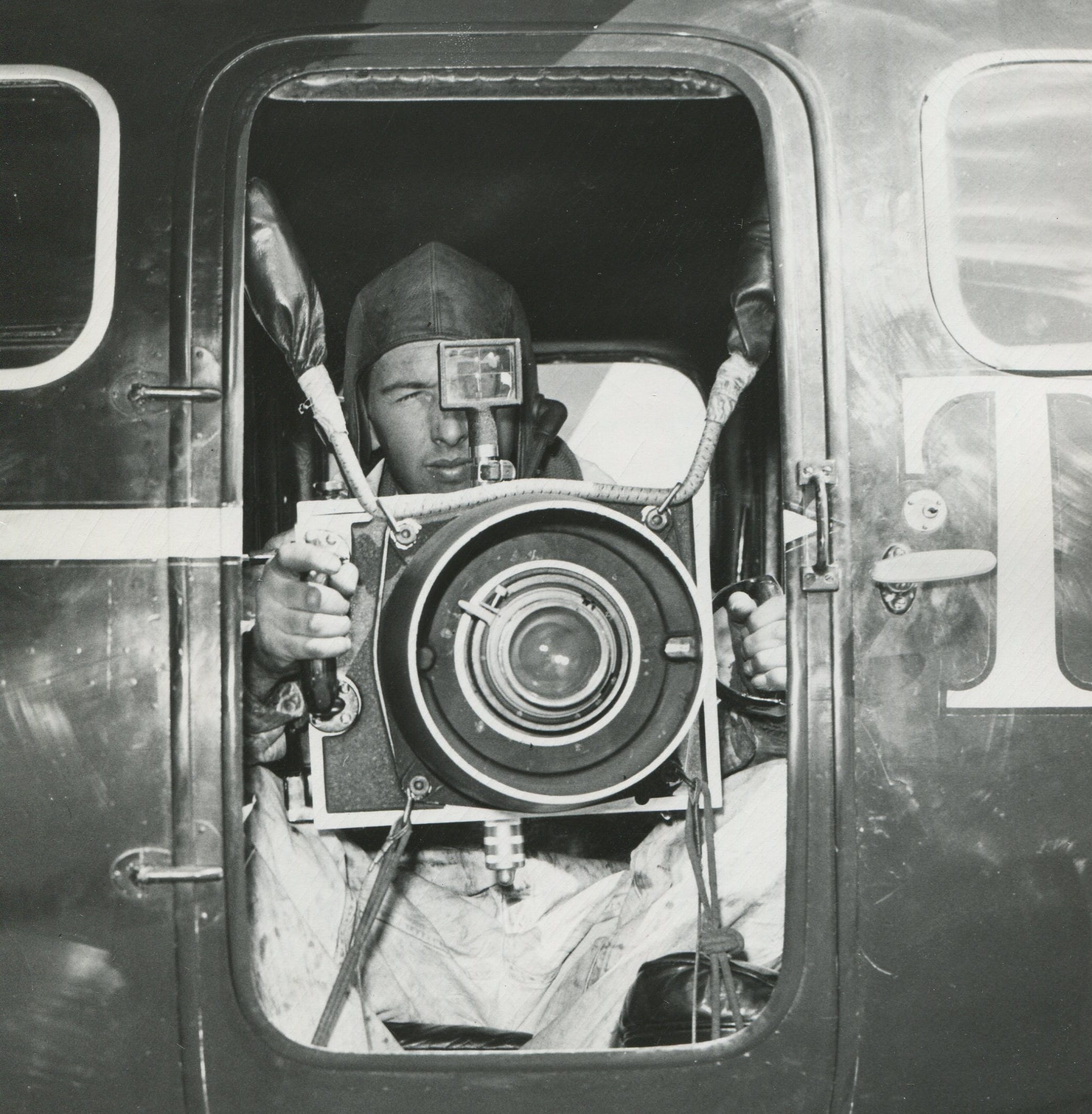 William A. Kuenzel is seen manning one of The Detroit News' specially-built aerial cameras.