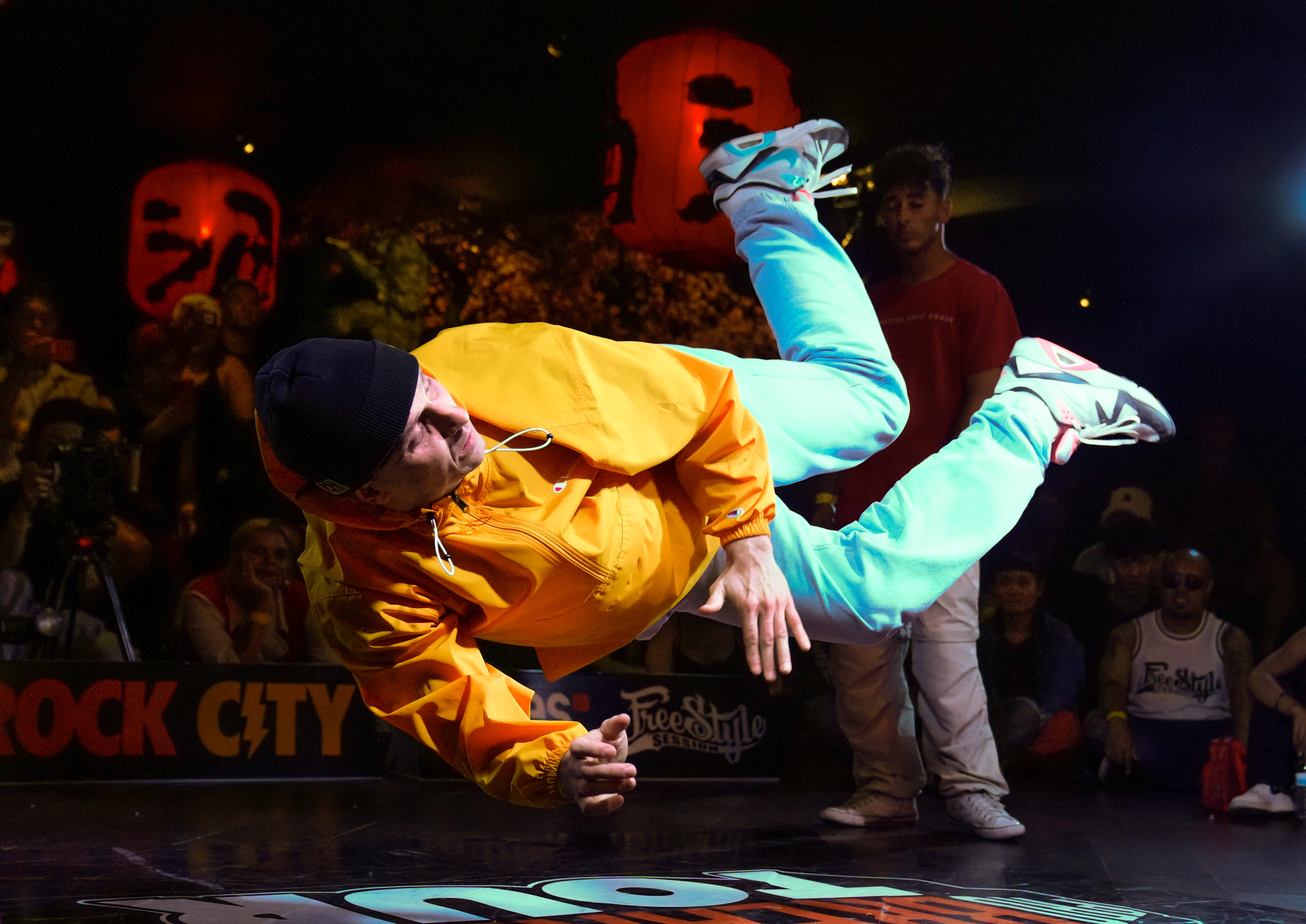 Mykhailo Sivets hangs in the air as he competes in the Snipes Pro Breaking Tour event in the JiangHu Bistro in Alhambra, California. Breaking makes its Olympic debut at the Paris Games next summer.