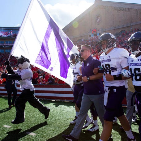 Northwestern head coach Pat Fitzgerald leads him team onto the field after the national anthem before their game against Wisconsin Saturday, September 30, 2017 at Camp Randall Stadium in Madison, Wis. Wisconsin beat Northwestern 33-24.        MARK HOFFMAN/MILWAUKEE JOURNAL SENTINEL (Via OlyDrop)