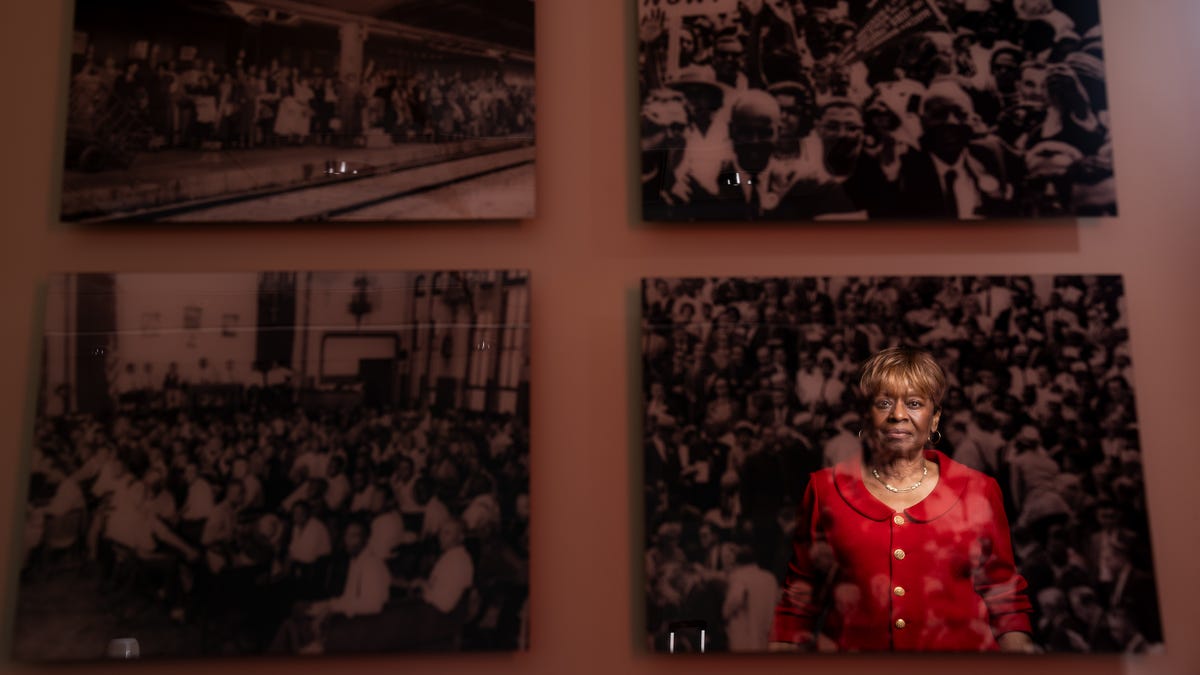 Clayola Brown, president of the A. Philip Randolph Institute is reflected in images of events surrounding the civil rights movement and 1963 March on Washington as she poses for a portrait on Friday, June 23, 2023. As a teenager, Brown attended the March on Washington, which will be celebrating its 60th anniversary this August.