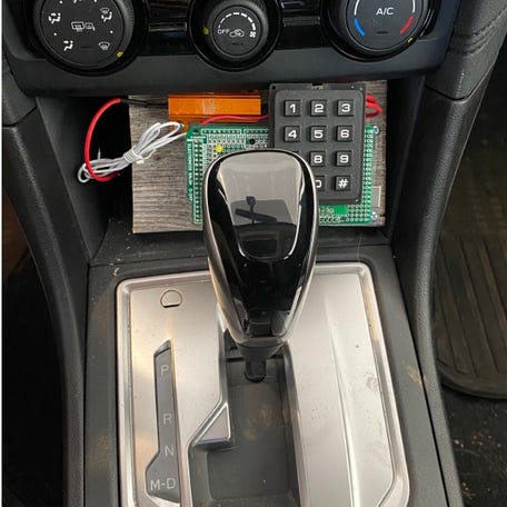 An experimental prototype of the Battery Sleuth code entry device from the University of Michigan installed in a vehicle.