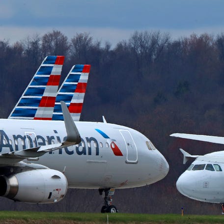 In this March 31, 2020 file photo American Airlines planes are parked at Pittsburgh International Airport in Imperial, Pa.