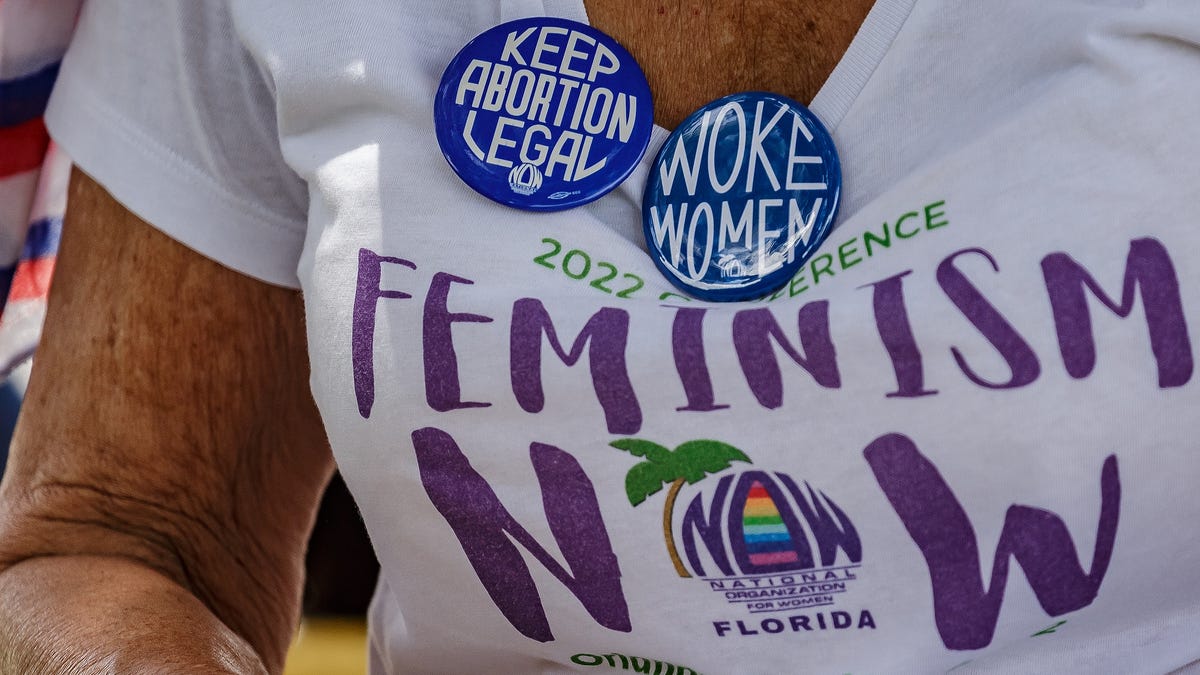 Book ban opponents wave signs outside Palm Beach County School District HQ