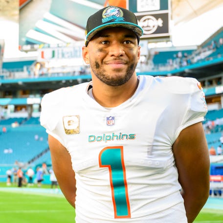 Miami Dolphins quarterback Tua Tagovailoa (1) smiles on the field after the Dolphins defeated the Cleveland Browns during an NFL football game, Sunday, Nov. 13, 2022, in Miami Gardens, Fla.