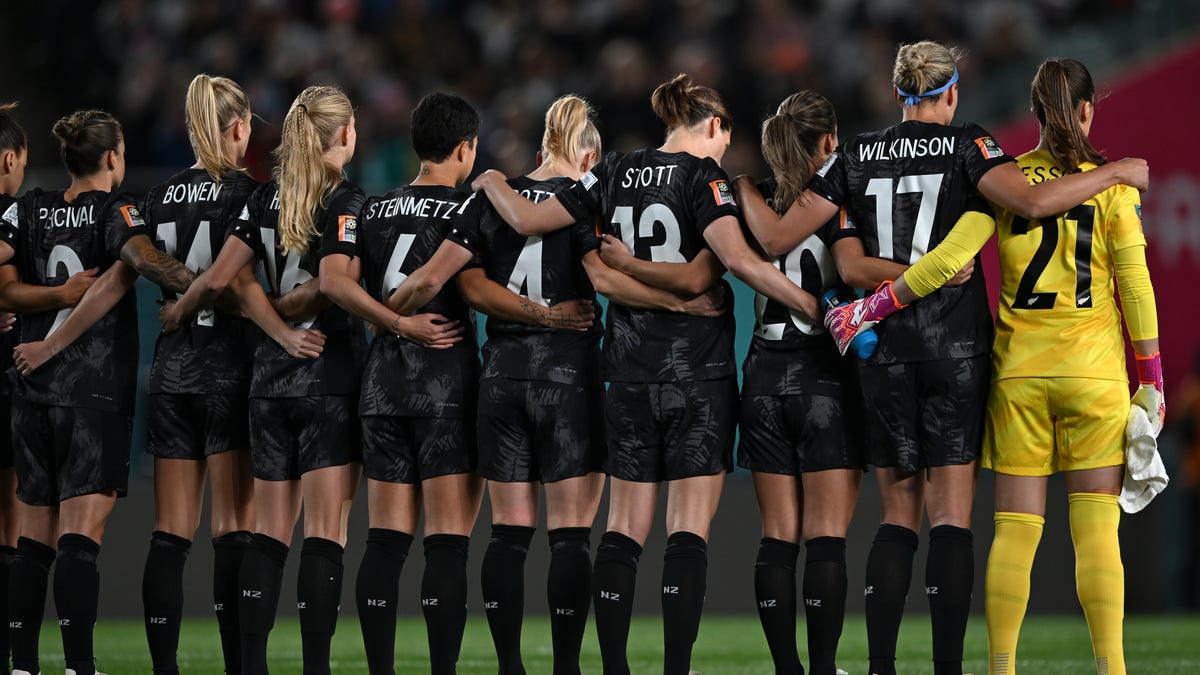 New Zealand players observe a moment of silence for the victims of a shooting attack in Auckland before the Women's World Cup soccer match between New Zealand and Norway in Auckland, New Zealand, Thursday, July 20, 2023.