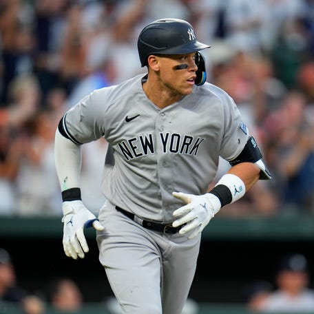 New York Yankees' Aaron Judge follows watches his two-run home run off Baltimore Orioles starting pitcher Tyler Wells during the third inning of a baseball game Saturday, July 29, 2023, in Baltimore. (AP Photo/Julio Cortez)