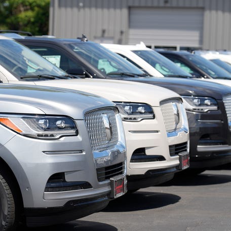 Unsold 2023 Aviator sports-utility vehicles sit in a long row at a Lincoln dealership on June 18, 2023, in Englewood, Colo.