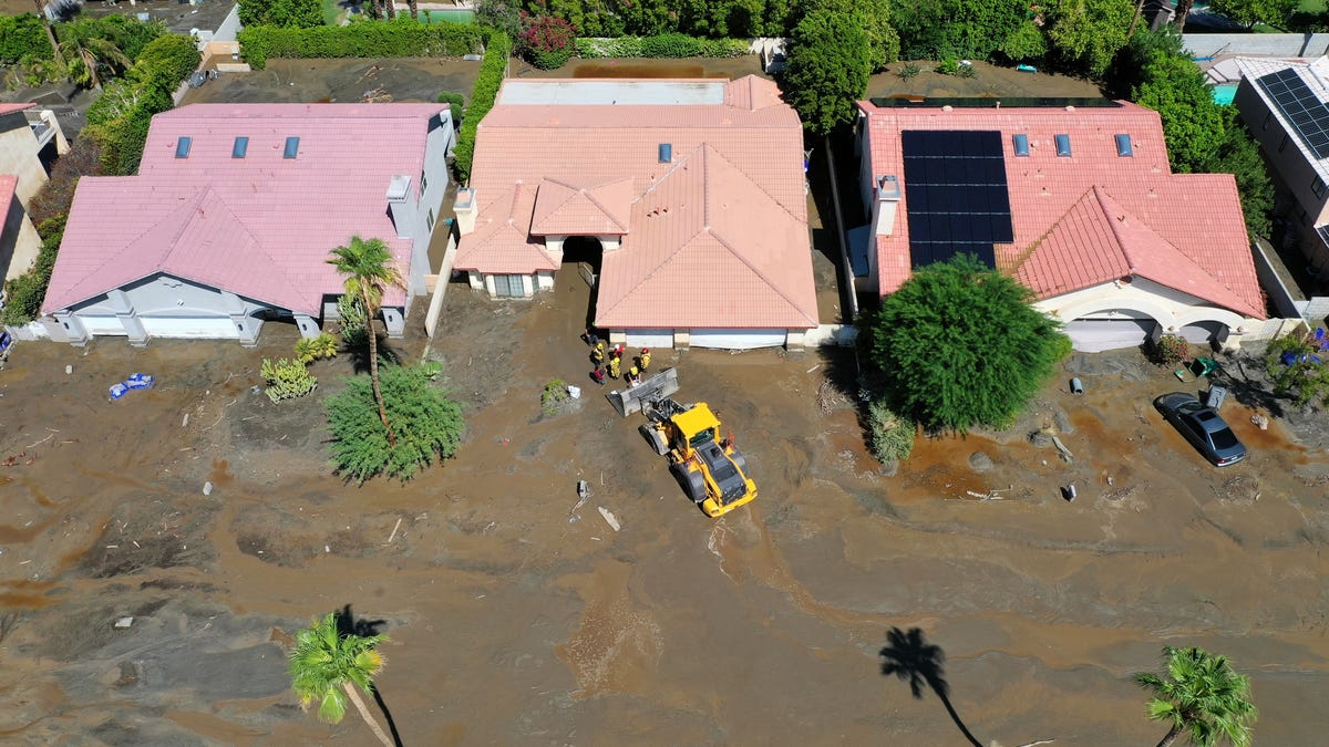 Cathedral City Fire firefighters rescue residents of an elderly care home after the home on Horizon Drive became inundated with mud from Tropical Storm Hilary in Cathedral City, Calif., on Monday, August 21, 2023.