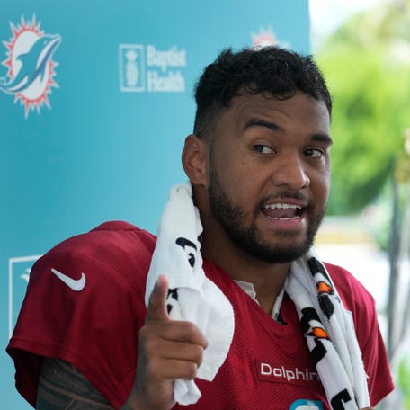 Miami Dolphins quarterback Tua Tagovailoa answers questions during a news conference after a joint practice with the Atlanta Falcons at the NFL football team's training facility, Wednesday, Aug. 9, 2023, in Miami Gardens, Fla.