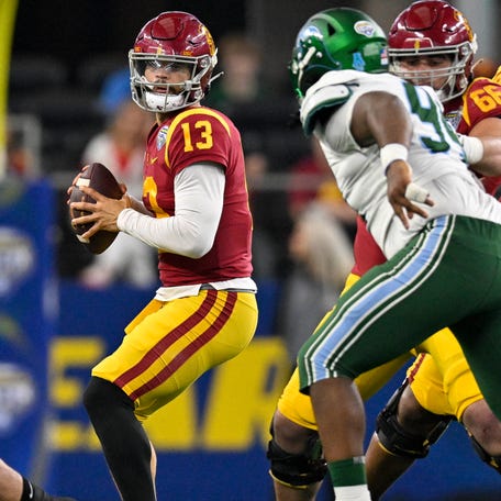 Southern California quarterback Caleb Williams (13) looks to throw against Tulane during the 2023 Cotton Bowl at AT&T Stadium.