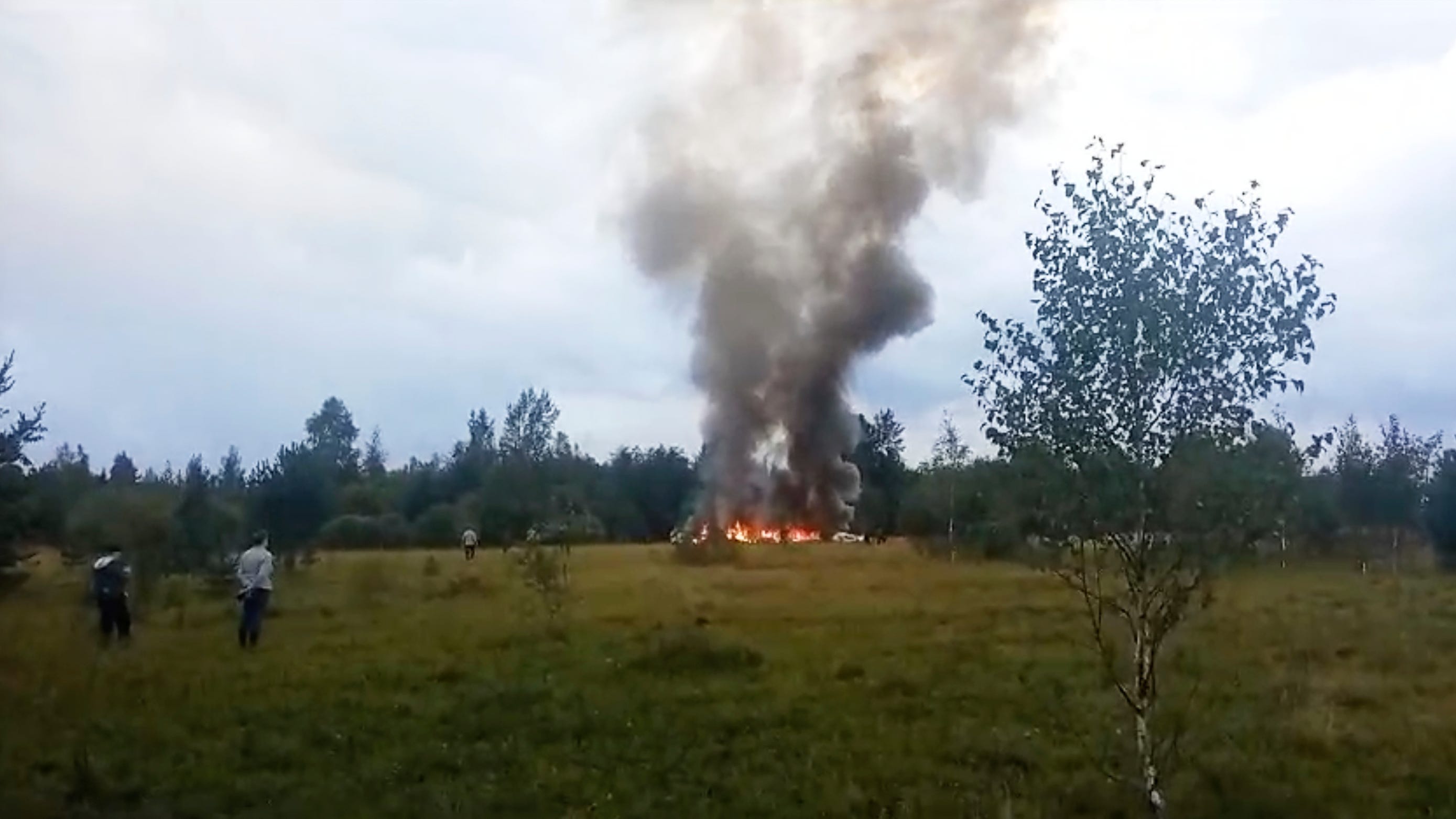 In this image taken from video, smoke and flames rise from a crashed private jet near the village of Kuzhenkino, Tver region, Russia, on Aug. 23, 2023.