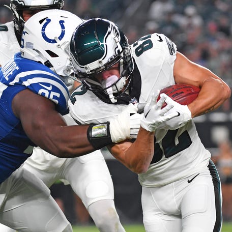 Philadelphia Eagles wide receiver Devon Allen (82) slips a tackle by Indianapolis Colts defensive end Adetomiwa Adebawore (95) as he returns the kick-off during the first quarter at Lincoln Financial Field.