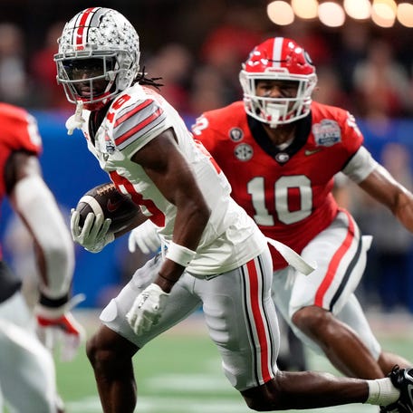 Ohio State wide receiver Marvin Harrison Jr. (18) runs after a catch against Georgia during the second quarter of the Peach Bowl in the College Football Playoff semifinal at Mercedes-Benz Stadium.