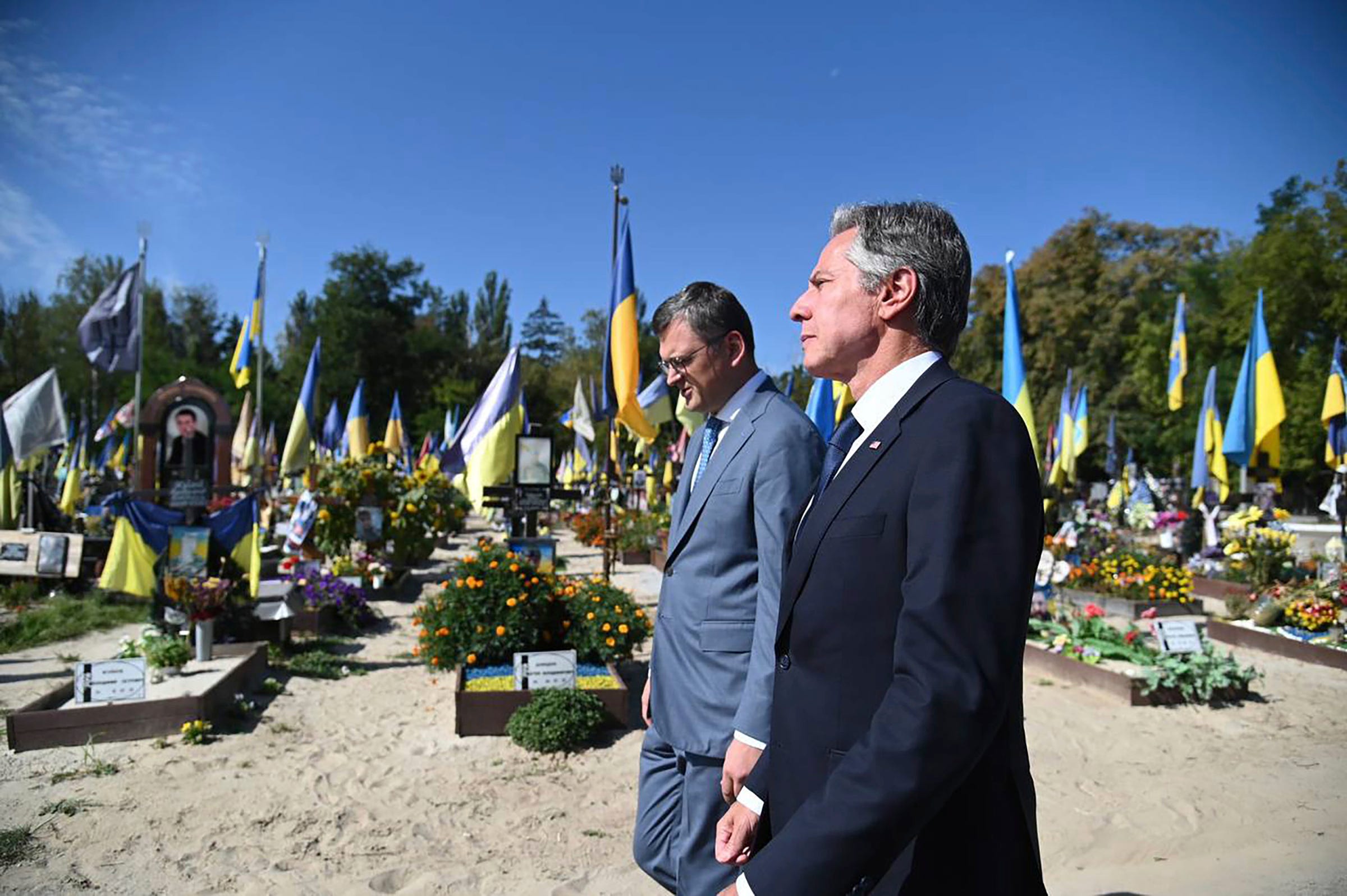 In this photo provided by Ukrainian Ministry of Foreign Affairs, U.S. Secretary of State Antony Blinken, right, and Ukrainian Foreign Minister Dmytro Kuleba, walk at the Alley of Heroes at the Berkovetske cemetery in Kyiv Wednesday, Sept. 6, 2023, in Kyiv, Ukraine.