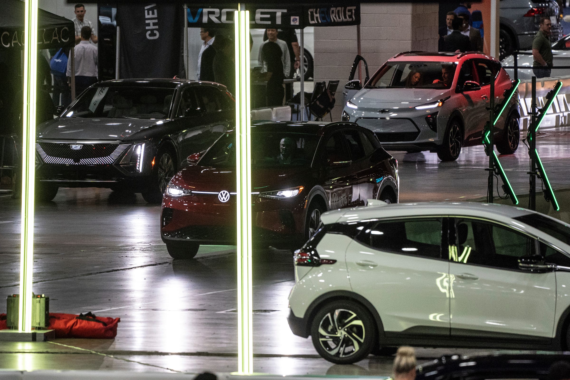 People take a ride in electric vehicles in the Powering Michigan EV Experience during the 2023 North American International Detroit Auto Show held at Huntington Place in downtown Detroit on Wed., Sept. 13, 2023.