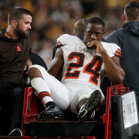 Cleveland Browns running back Nick Chubb is taken from the field on a cart after suffering a left knee injury against the Pittsburgh Steelers during the second quarter at Acrisure Stadium, Sept. 18, 2023 in Pittsburgh.