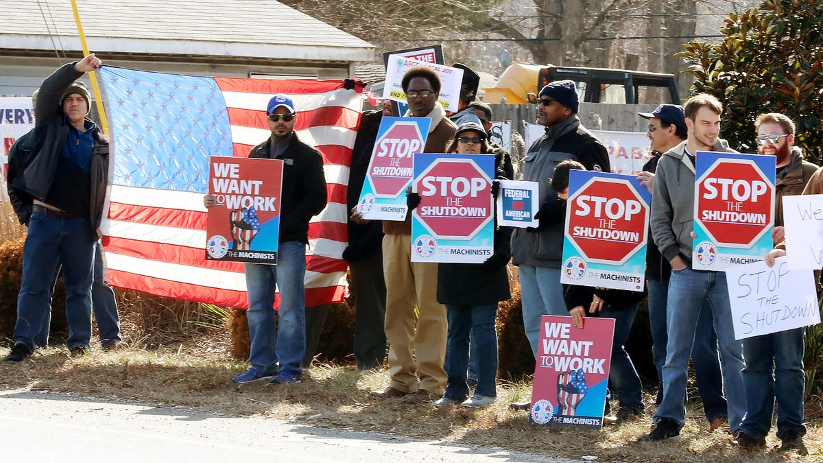 Federal workers and contractors in Harbor Township, N.J., on Jan. 25, 2019, protest the government shutdown. The federal shutdown lasted for 35 days.