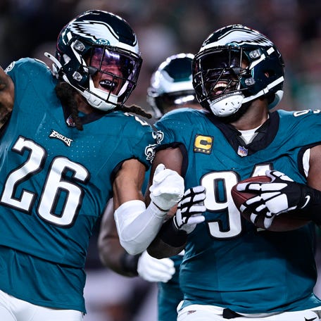 Philadelphia Eagles safety Terrell Edmunds (26) and Eagles defensive tackle Fletcher Cox (91) celebrate Cox's fumble recovery during the second half of an NFL football game against the Minnesota Vikings on Thursday, Sept. 14, 2023, in Philadelphia.