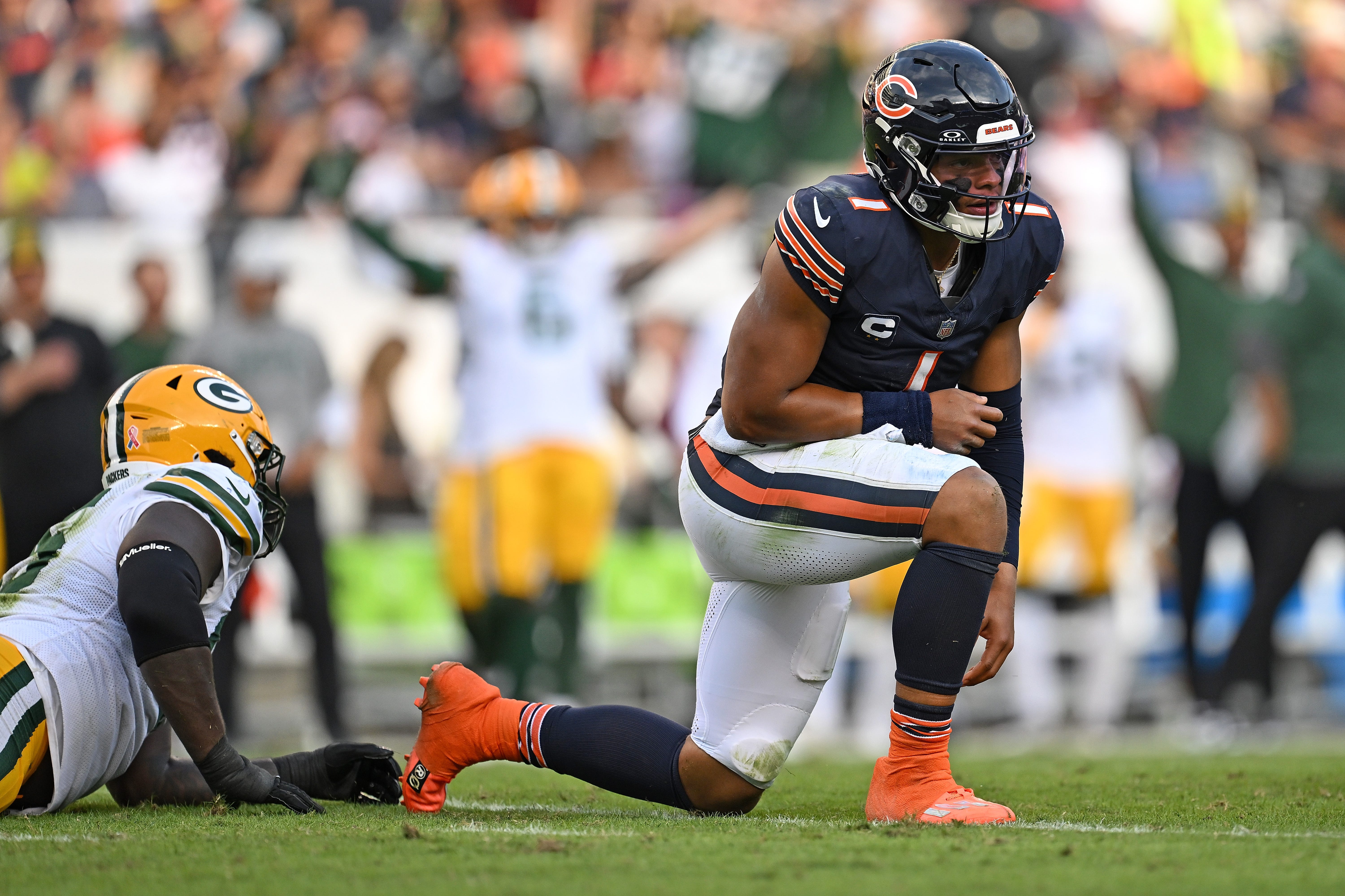 Justin Fields #1 of the Chicago Bears reacts after fumbling the ball against the Green Bay Packers during the second half at Soldier Field on September 10, 2023 in Chicago, Illinois.